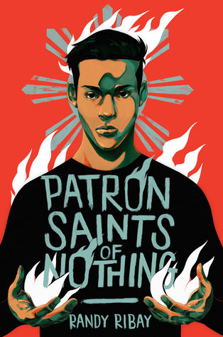 Book cover-illustrated. The background is red. Against this background is a young person wearing a black t-shirt. He has copper coloured skin and short dark hair. In his hands are white flames and behind his head and shoulders are white flames. He is looking directly at the reader. On his t-shirt the title is written in gray blue: "Patron Saints of Nothing" The author's name is below: Randy Ribay. 